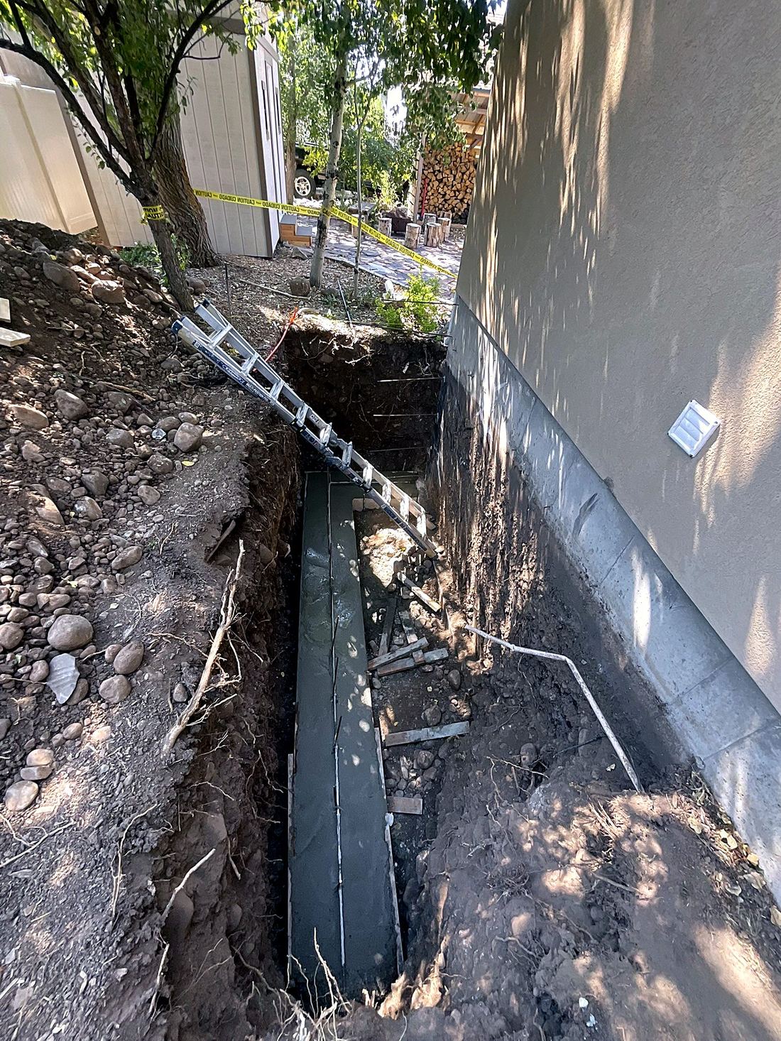 Engineered concrete footing for a walkout entrance